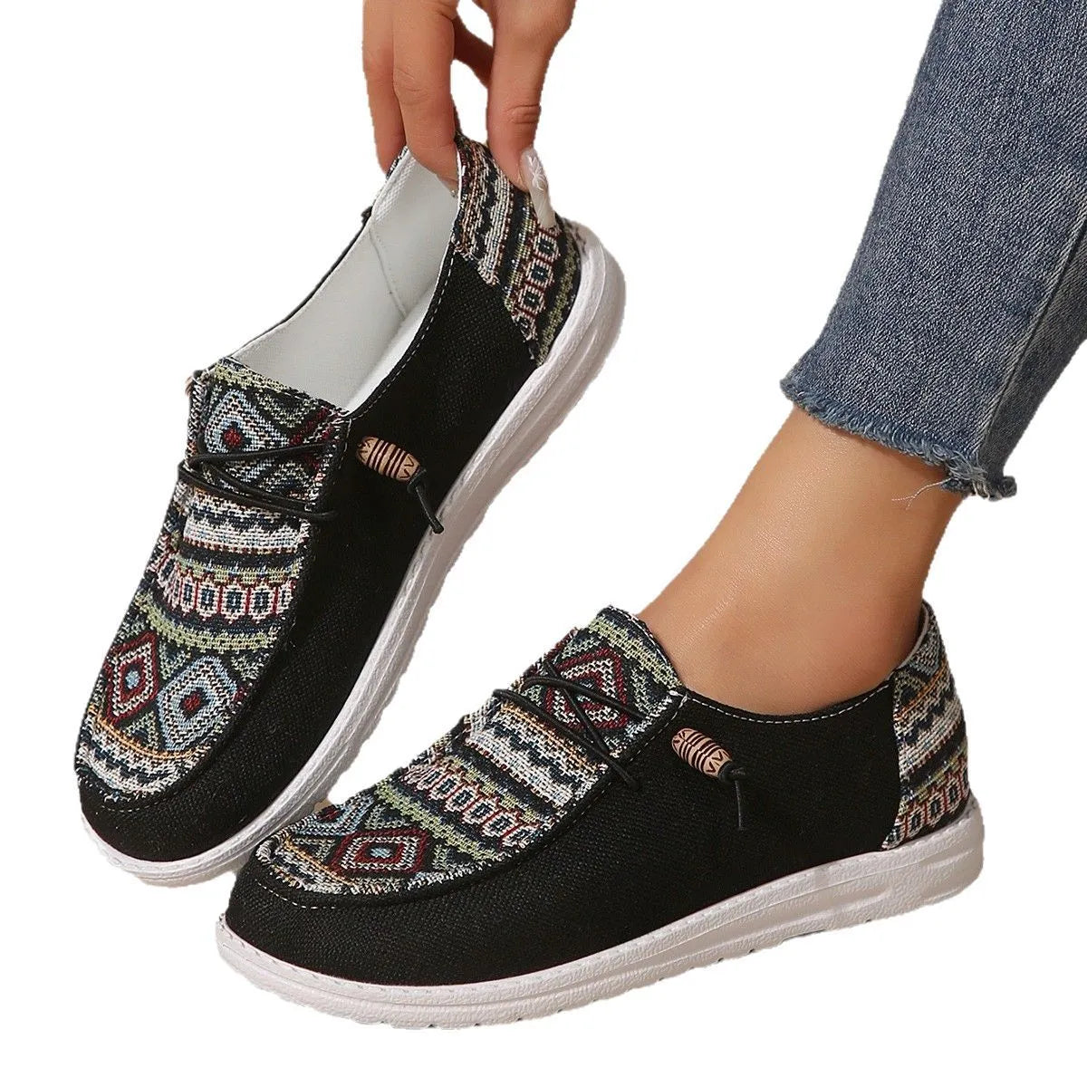Women's flat round toe shoes in black, dark grey, and khaki with a low-top design and rubber sole.
