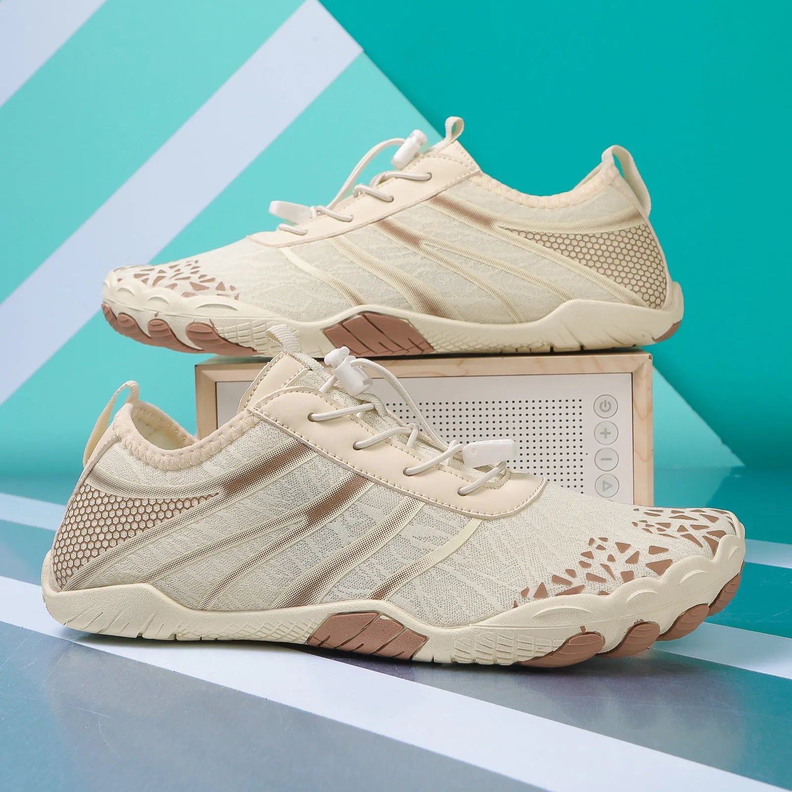 Lycra stretch fabric casual running shoes for men and women on a beach background.