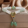 Green crystal women's bracelet with Tian Shan Cui abacus beads and retro butterfly tassel design measuring 17 cm