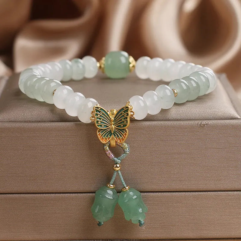 Green crystal women's bracelet with Tian Shan Cui abacus beads and retro butterfly tassel design measuring 17 cm