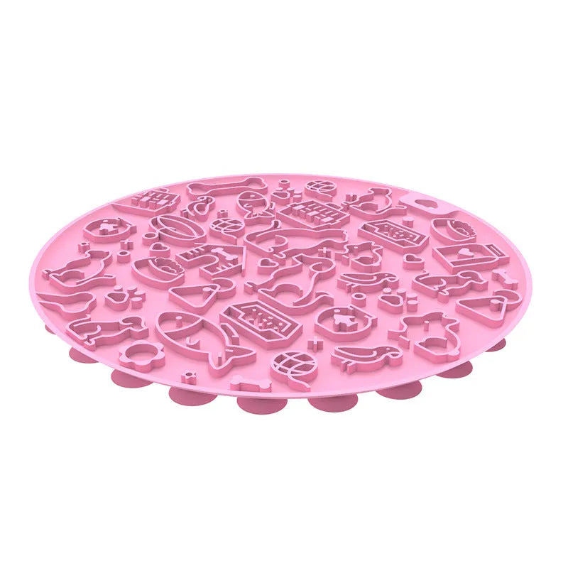 Round silicone pet licking mat with suction cup base in blue colour on a floor.