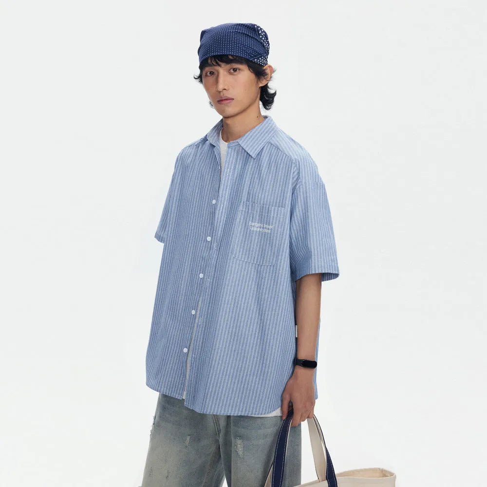 Blue striped short-sleeved overalls shirt with loose cardigan fit on hanger