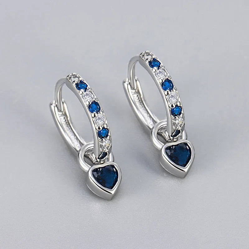 Women's copper earrings with heart-shaped drops and coloured stone accents in gold or white gold tone settings