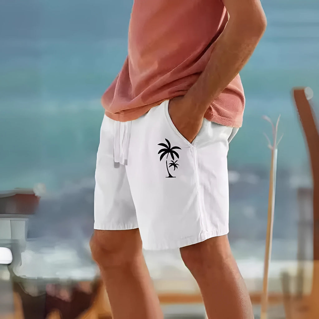 Men's straight leg cotton blend drawstring beach shorts with botanical heat transfer patch pattern