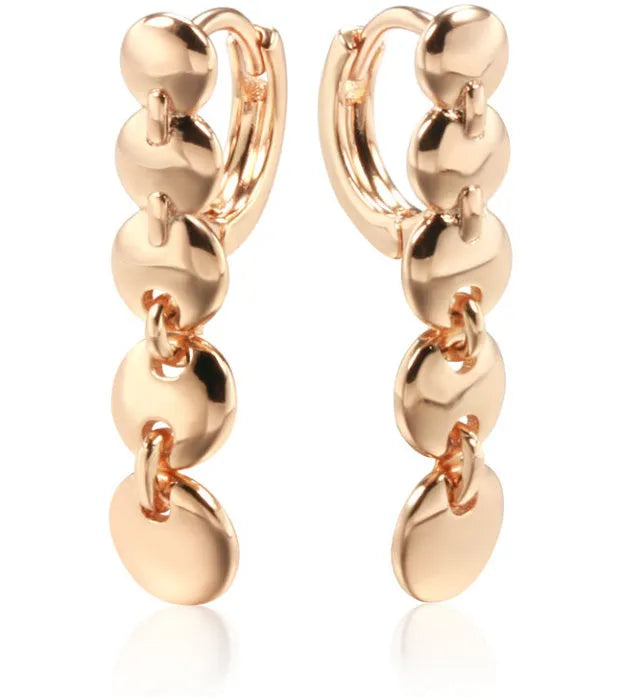 Gold woven copper circle earrings with retro circular design