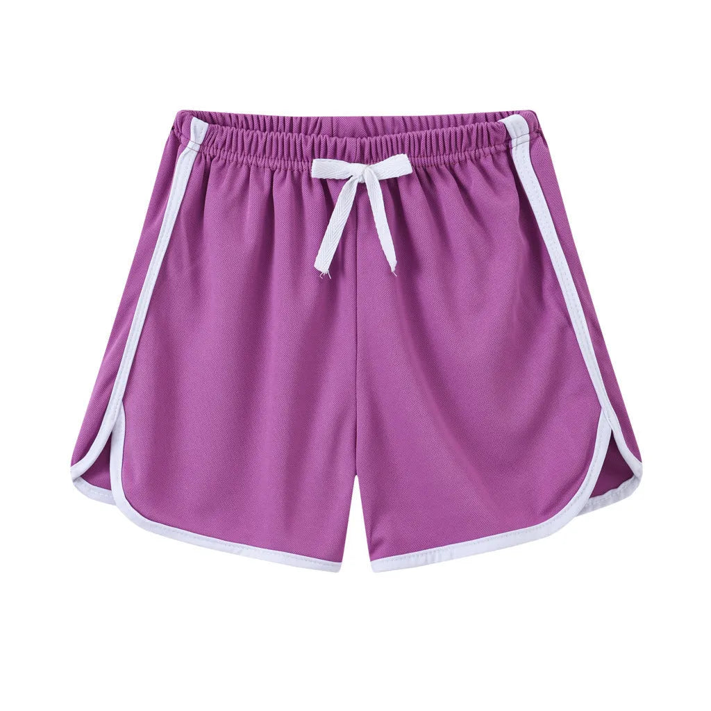Children's polyester beach shorts in various colours and patterns including stripes, prints and solid options
