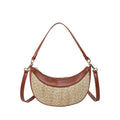 Hard woven straw dumpling-shaped crossbody shoulder bag with organised interior compartments.