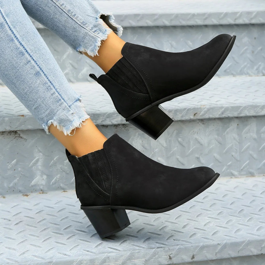 Women's black slip-on ankle boots with pointed toe and thick square heel for autumn winter wear