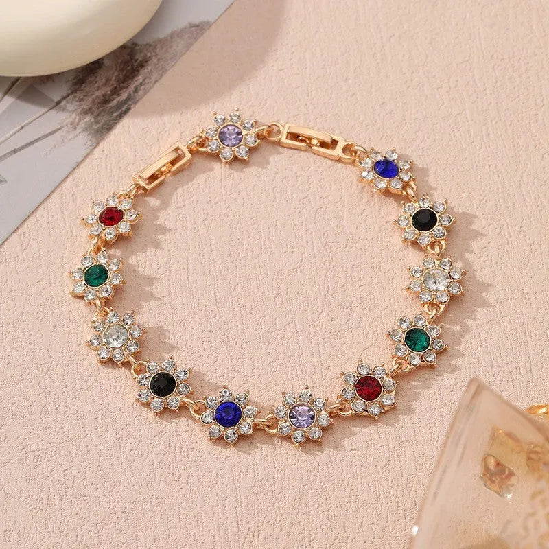 Floral-shaped zinc alloy bracelet with electroplated finish in gold and silver colour options.