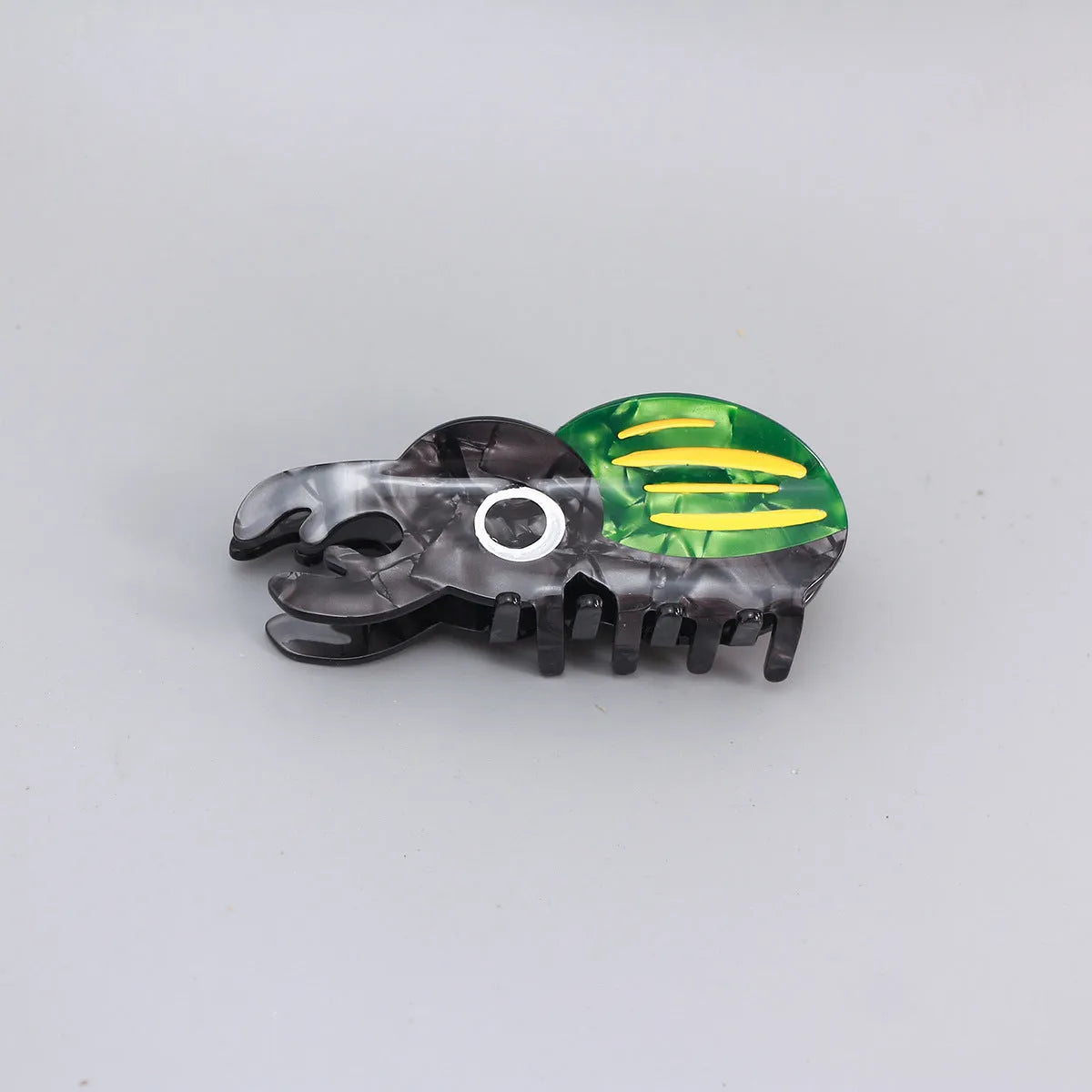 Cartoon-style beetle grip insect biology collectable on cellulose acetate sheet