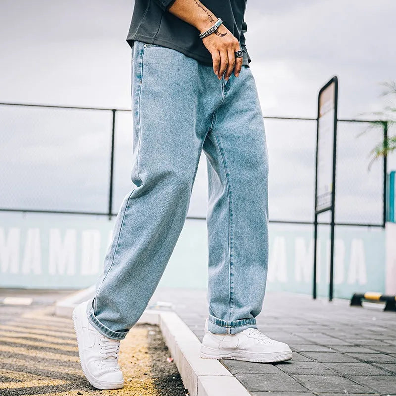 Men's loose straight jeans in dark blue colour showing mid waist and straight leg design