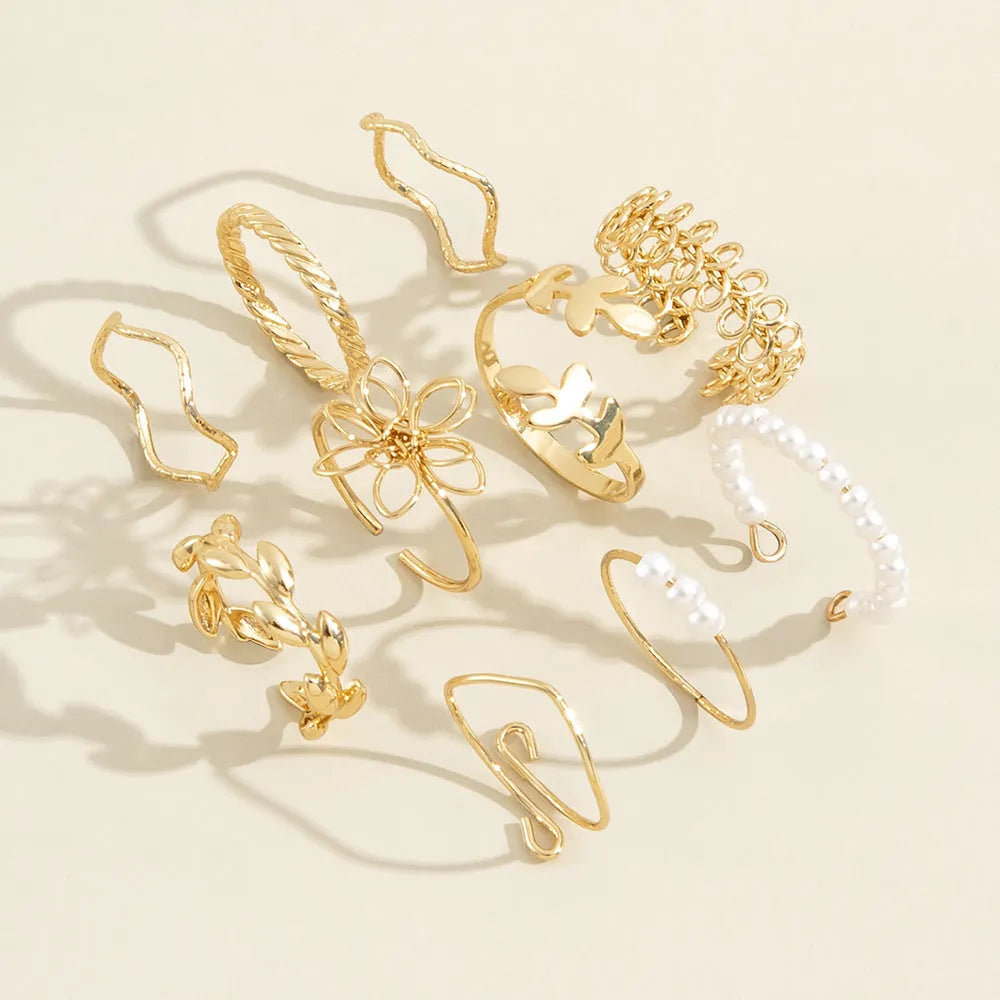 Women's openwork flower ring in gold colour J0656 with glossy electroplated finish and floral detailing