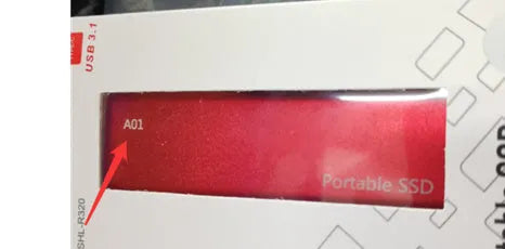 Metal-shell portable solid state drive with ultra-thin design on a desk.