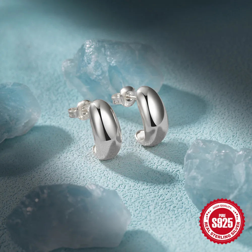 Sterling silver C-shaped geometric stud earrings with glossy electroplated finish