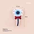 Plush cat wand toy with 27cm handle showing three interchangeable colourful heads: eyes, candy, and skull designs