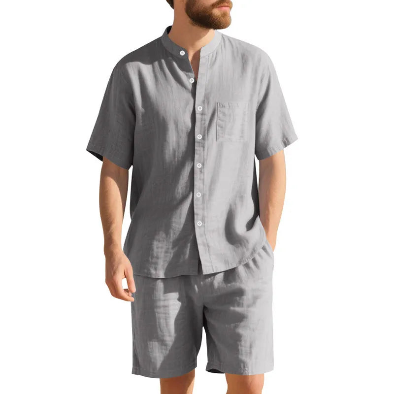 Men's light blue linen blend summer suit with henry collar, short sleeves, and matching shorts