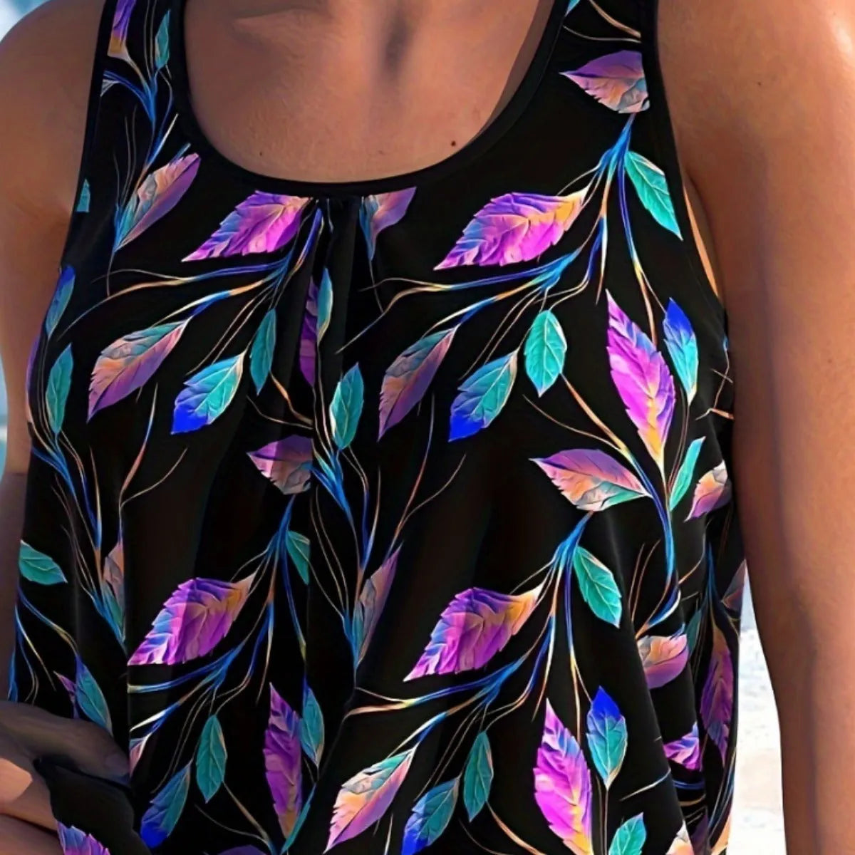 Women's leaf pattern split front swimsuit with halter neck top and matching shorts in solid colour
