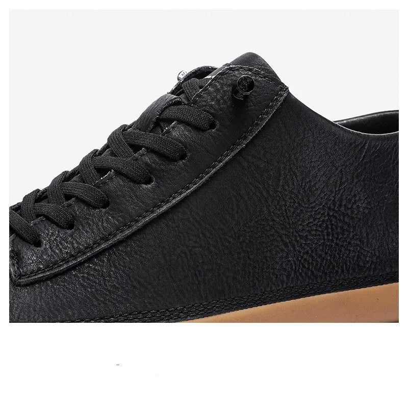 Men's black leather casual shoes with round toe, flat heel, and white lace-up closure.