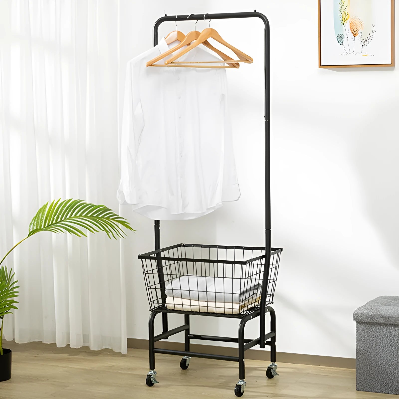 White iron frame single rod clothes rack on wheels with a pulley height adjustment system.