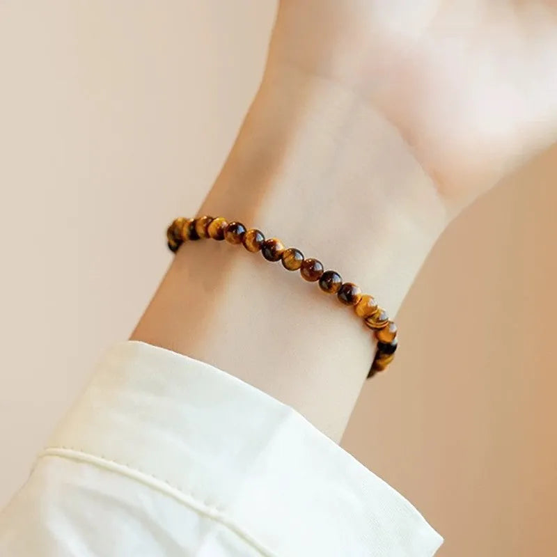 Tigereye bracelet with geometric new Chinese style design showing round beads in natural stone