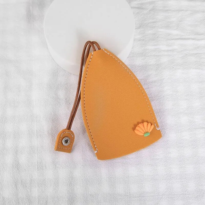 Cartoon pull-out key case in PU leather showing design options including resin fruit and big cartoon animal prints.