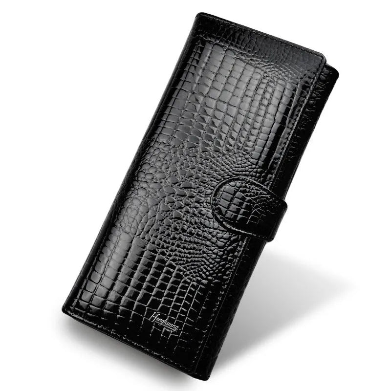 Women's red patent leather coin purse with crocodile pattern texture.