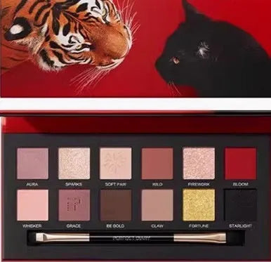 Explorer twelve-color animal eye shadow palette showing Golden Tiger Ink Cat, Red Fox, and Koi themed shades