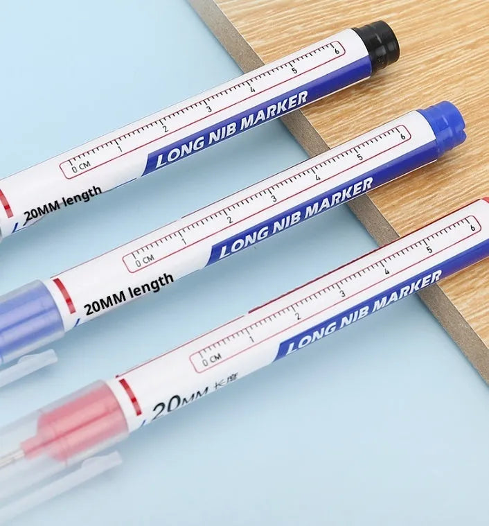 Multi-color deep hole marking pen with 20mm long tip on metal surface showing black ink mark