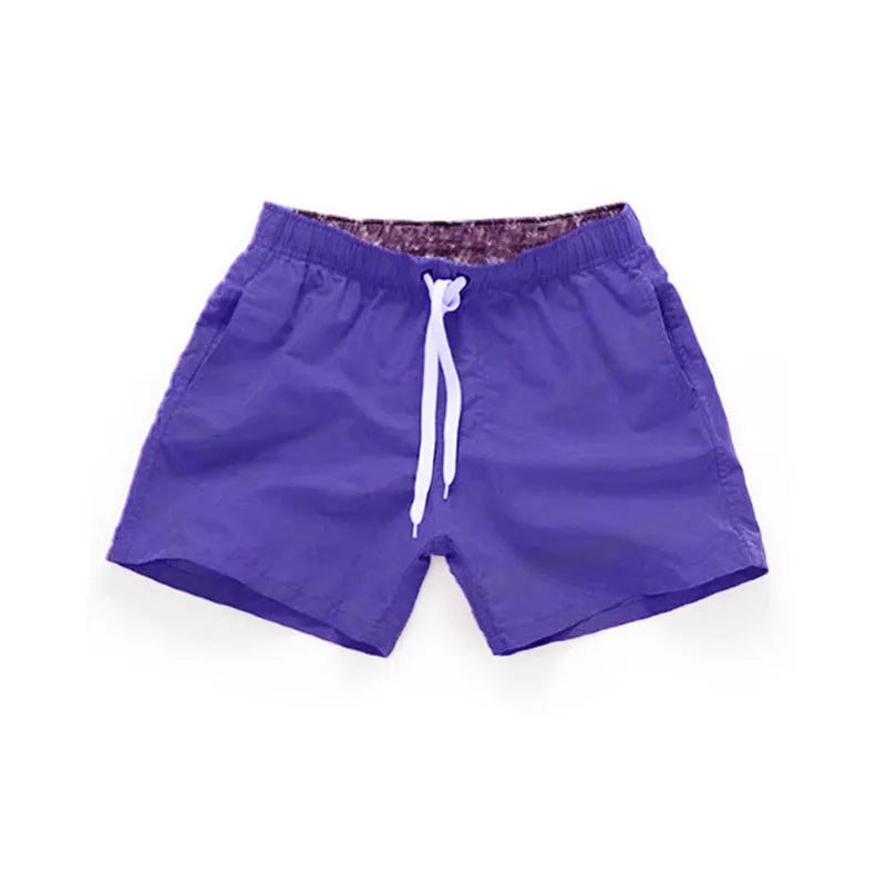 Men's straight-leg beach shorts in polyester, shown in a selection of available colours.