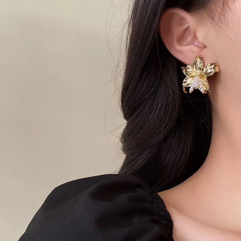 Gold H1795 pearl flower earrings with exaggerated floral design and Seiko-treated metal construction