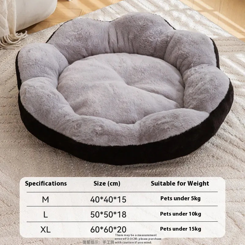 Round plush cat bed with removable cover in brown gray colour, shown in a home setting.