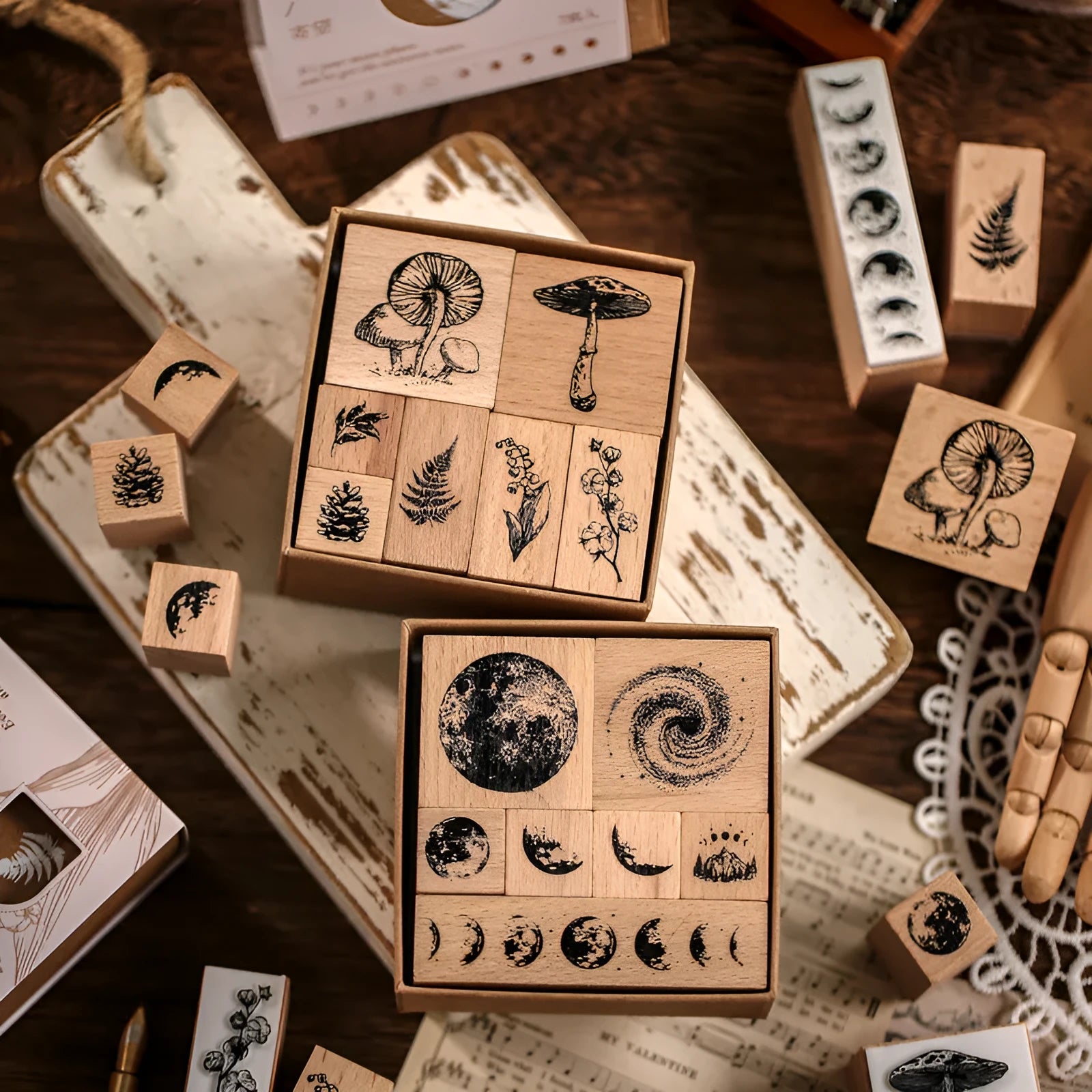 Wooden decorative seal stamp set with seven pieces showing botanical or celestial designs in mixed sizes