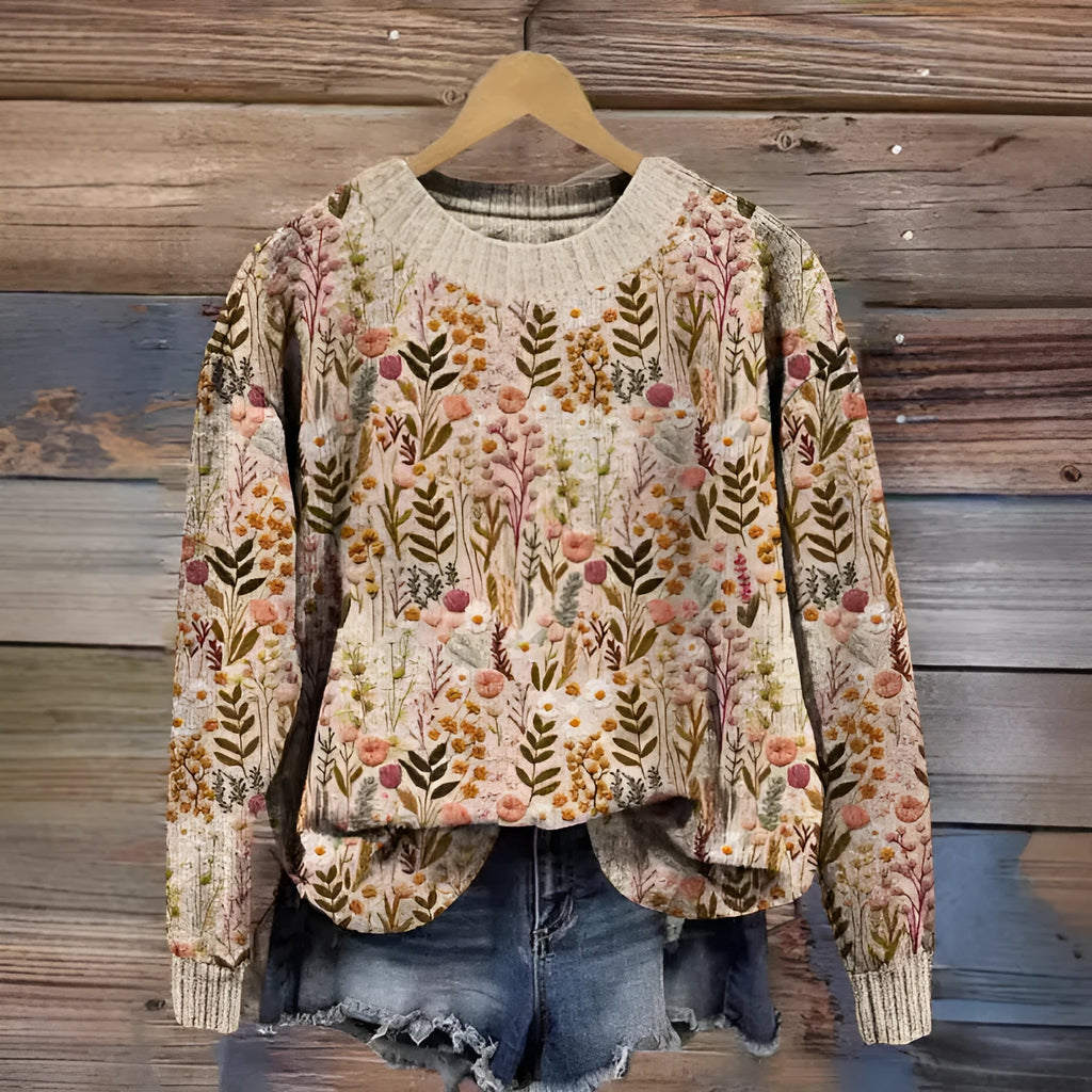 Women's round neck sweater with a small digital floral print in a solid colour.