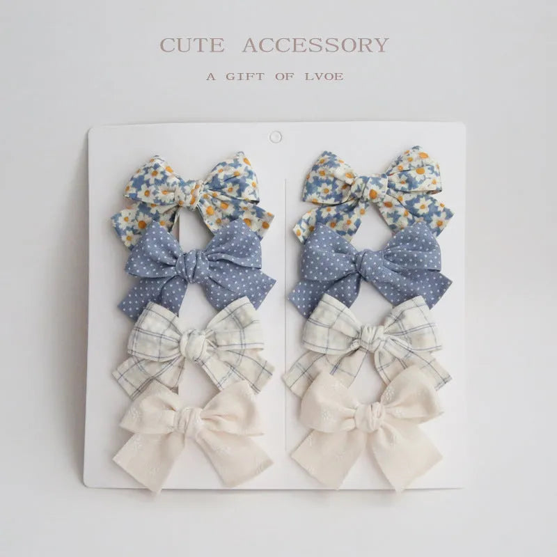 Children's eight-piece cloth bow hairclip set in dovetail shape with multiple colour options
