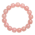 Natural pink crystal barrel-bead bracelet with 8x10mm polished geometry beads