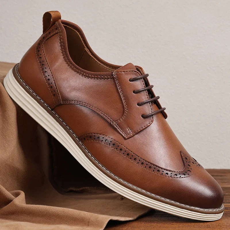 Men's black slip-on business casual shoes with round toe and decorative carving details