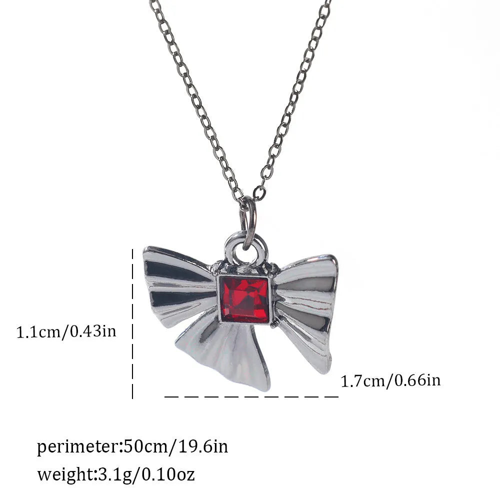 Gothic Halloween necklace with spider and bat alloy pendant on a chain.