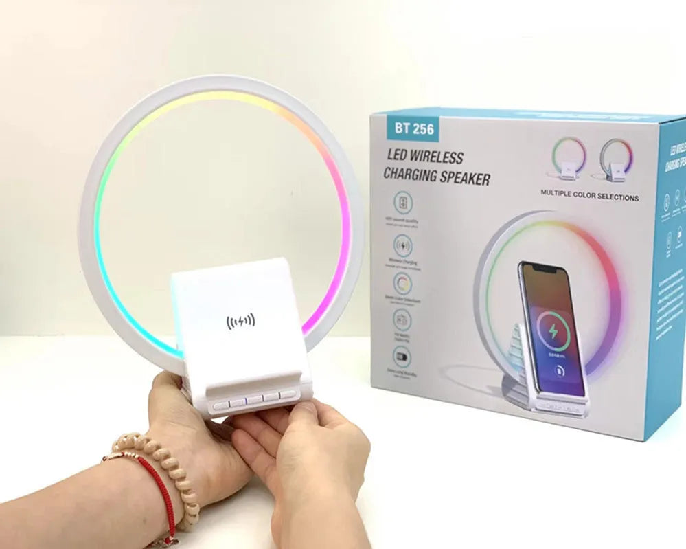 White smart Bluetooth speaker with wireless charging pad and ambient lighting measuring 225mm wide
