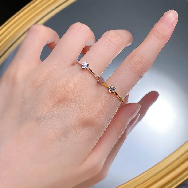 Minimalist silver crown-shaped ring with linear engraving detail in gold or platinum finish