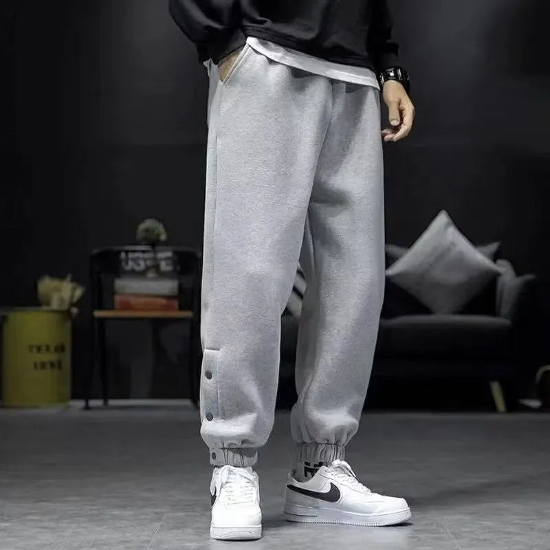 Velvet padded casual trousers for women in regular black with ankle strap and skinny leg style