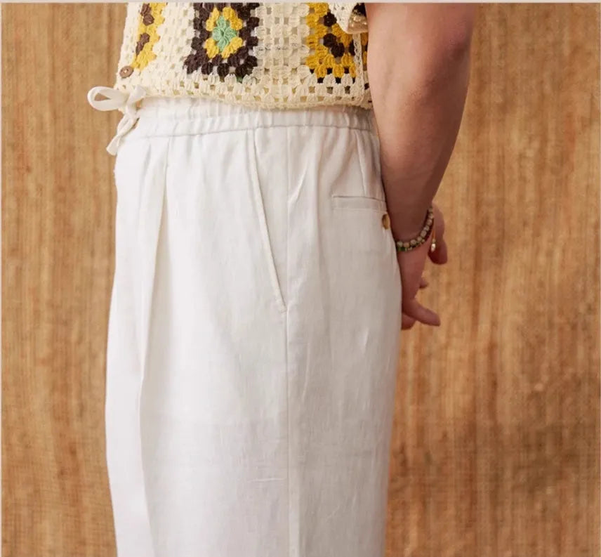 Women's linen straight-leg trousers with elasticated high waist and lace trim in navy blue colour.