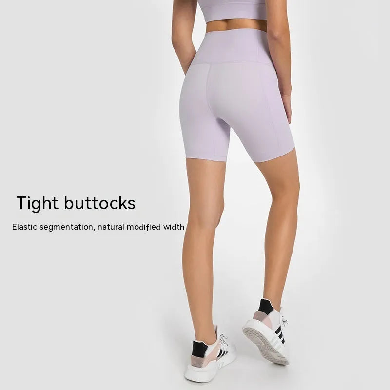 Women's black cotton blend super stretch sports shorts with mid-rise waist and short length.