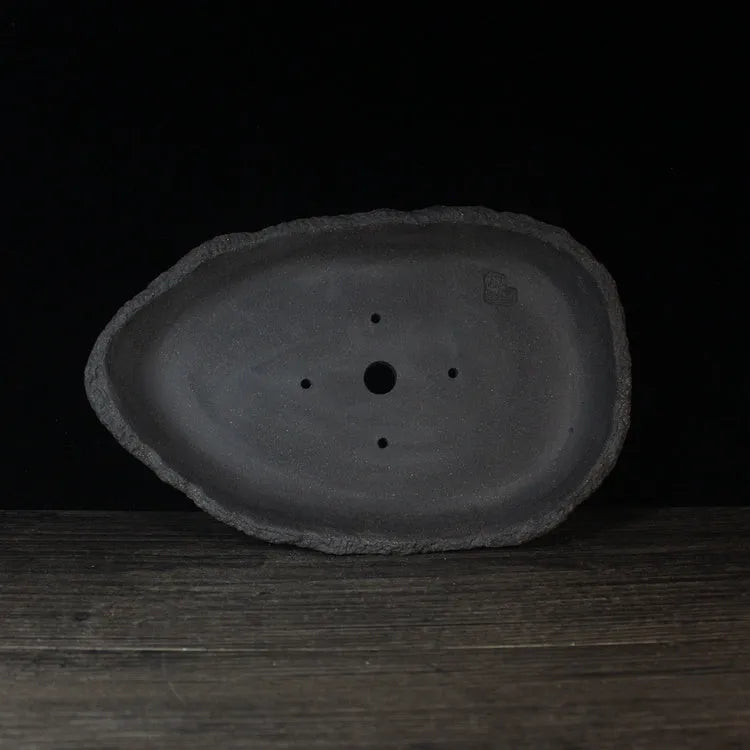 Handmade purple clay flower pot for floor-standing indoor plants in one of five decorative styles