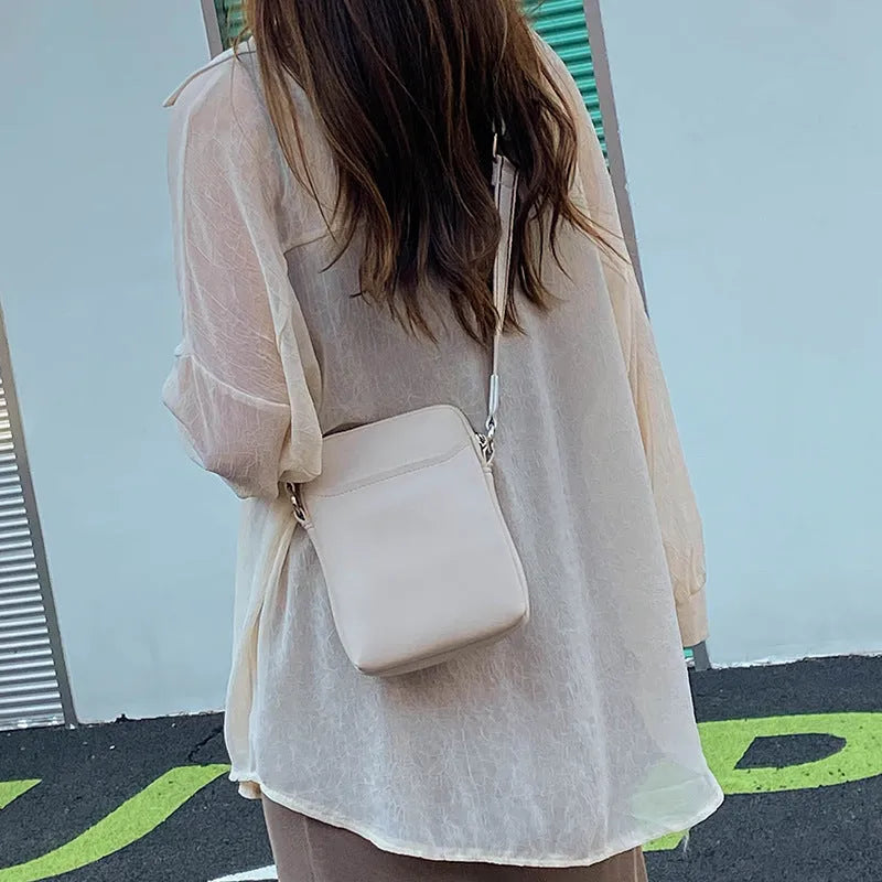 Solid colour simple PU crossbody shoulder bag for mobile phones in black, beige, khaki, or green.