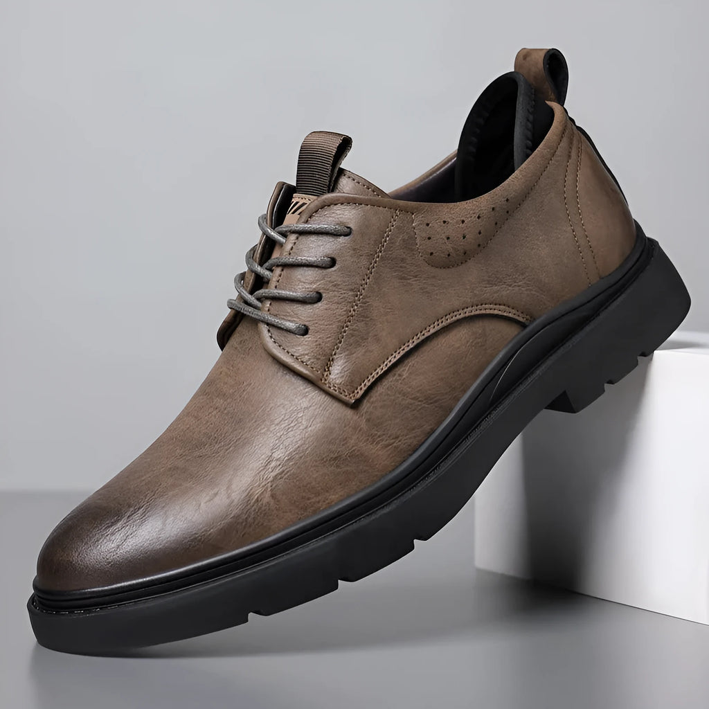 Men's black and brown leather sneakers with cowhide uppers and rubber soles
