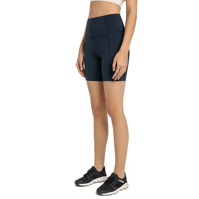 Women's black cotton blend super stretch sports shorts with mid-rise waist and short length.