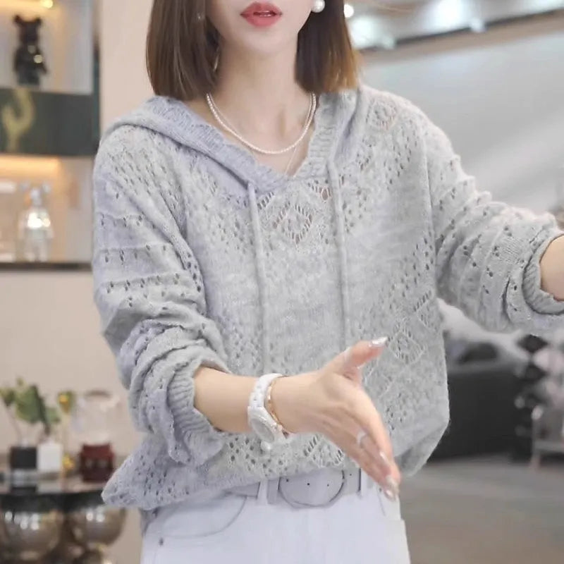 Women's loose-fit crochet hooded longsuit undershirt in a solid colour, showing long sleeves and textured knit detail.