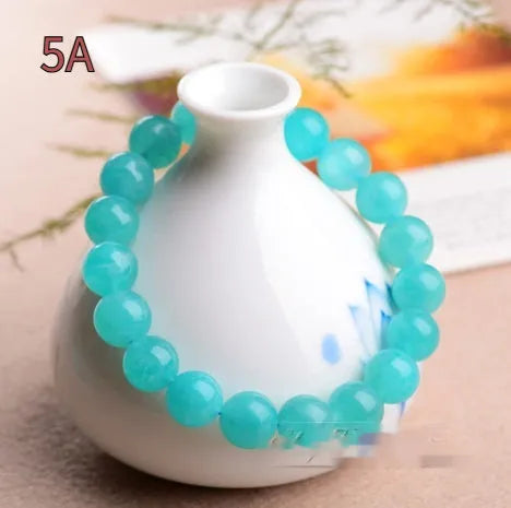 Natural 7A grade ice blue amazonite beads on a string, showing polished surfaces and varying sizes.