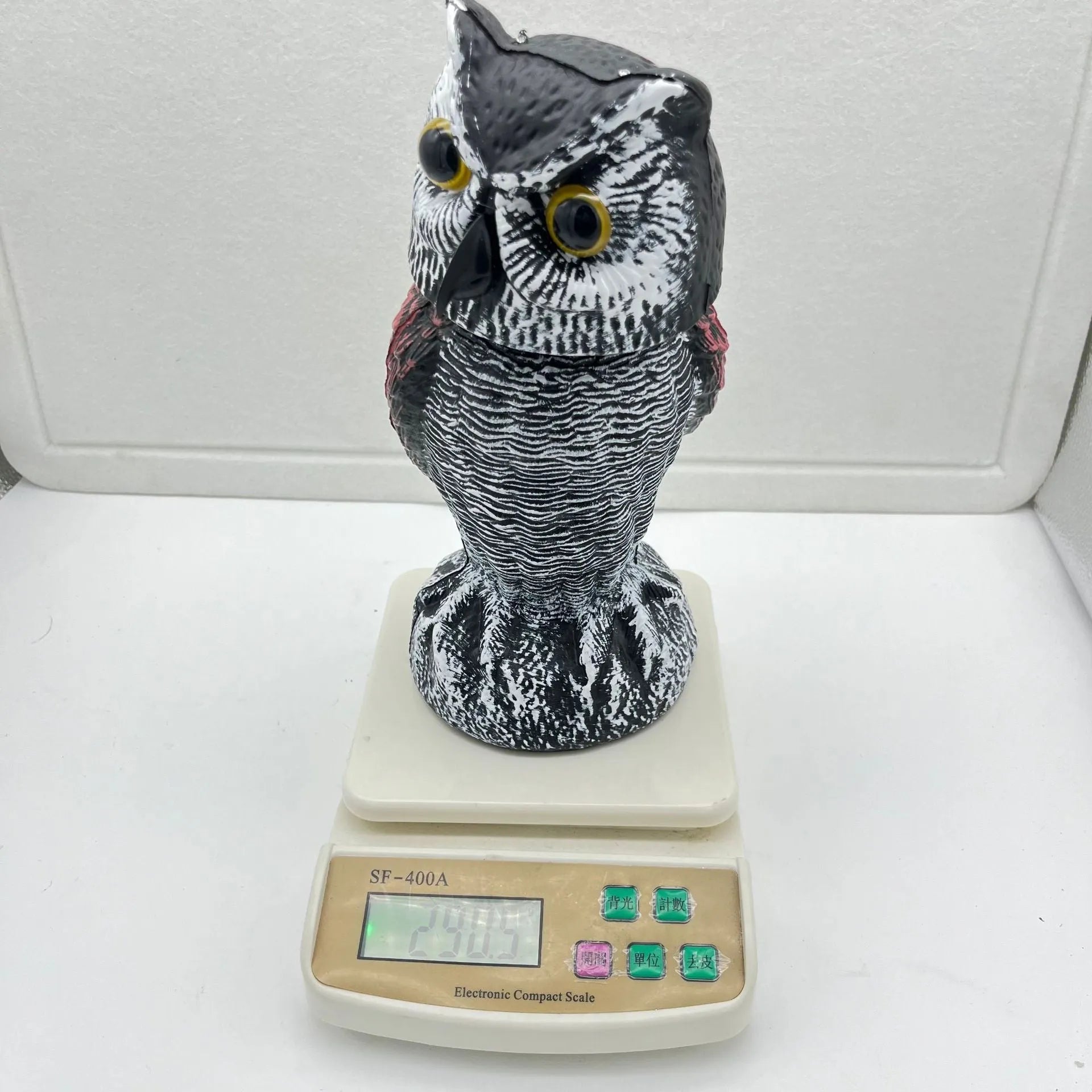 Artificial plastic owl bird scare ornament with moveable head for outdoor garden pest control