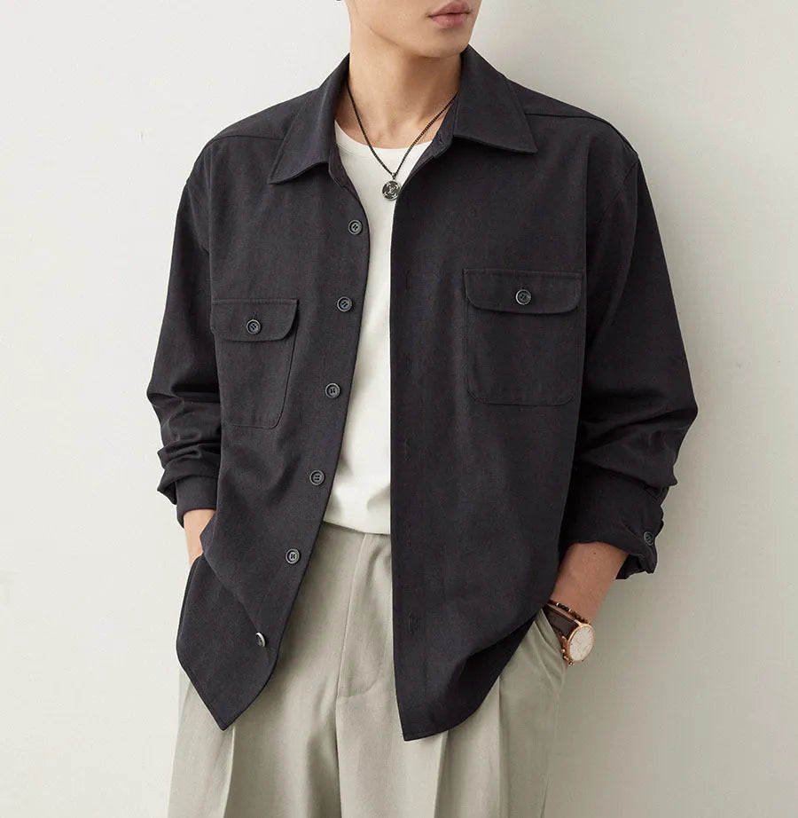 Men's light sand rice coloured cotton blend lapel shirt laid flat, showing long sleeves and simple collar design.
